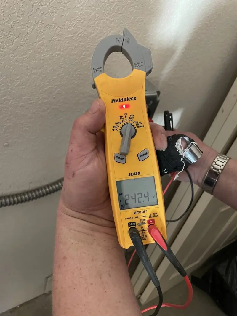 Voltage testing with clamp meter during Ceiling Fan Installation in Marysville